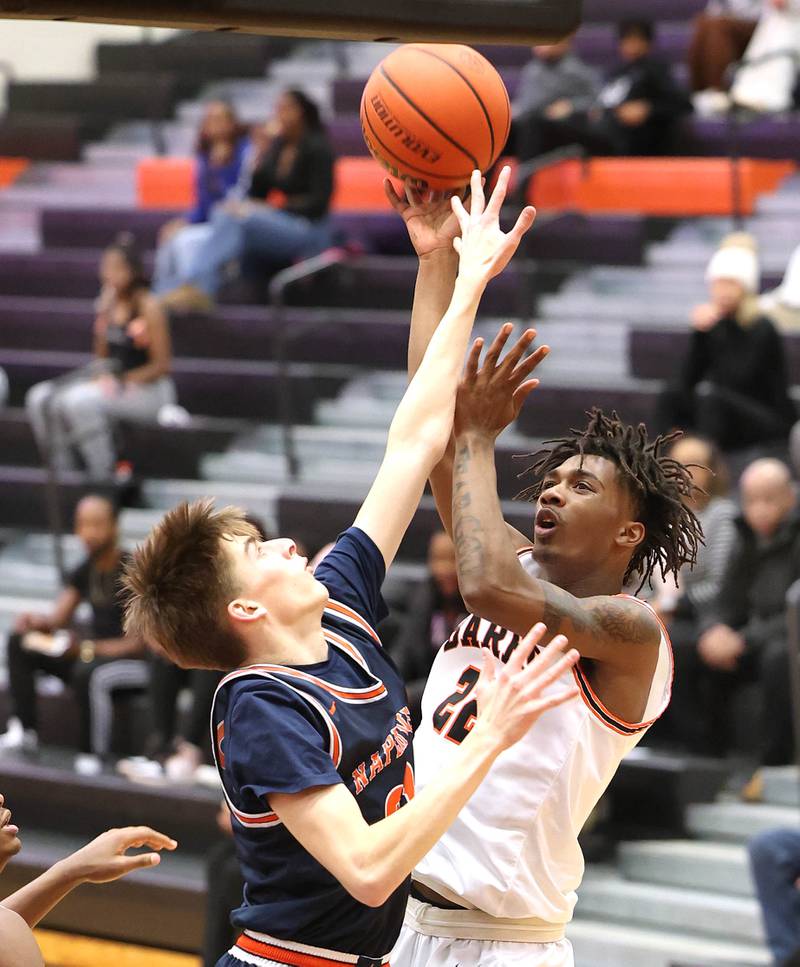 DeKalb's Darrell Island shoot8s over Naperville North's Grant Montanari during their game Monday, Jan. 30, 2023, at DeKalb High School.