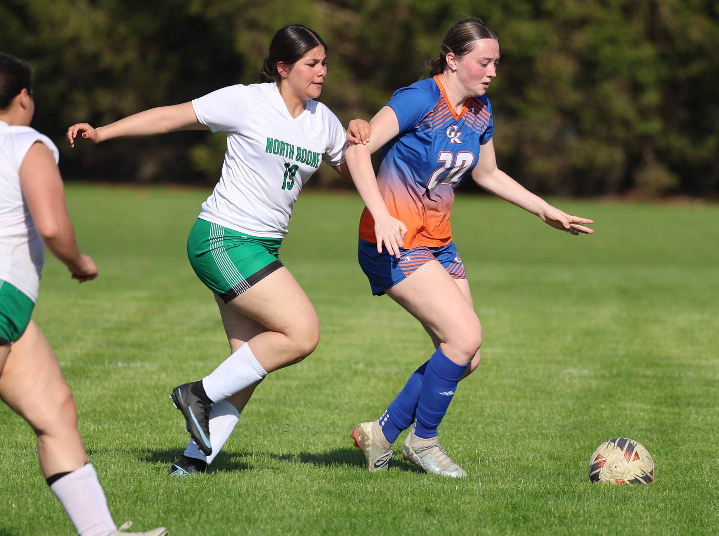 Genoa-Kingston's Olivia Leonforte (right) pushes the ball ahead Thursday, April 23, 2026, during their game against North Boone at Genoa-Kingston High School.
