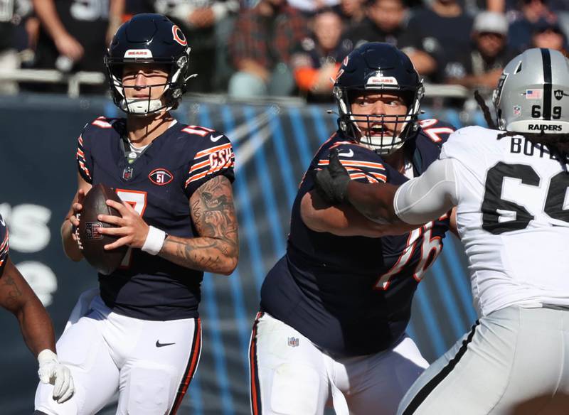 Chicago Bears quarterback Tyson Bagent sets up in the pocket as Chicago Bears offensive tackle Teven Jenkins blocks Las Vegas Raiders defensive tackle Adam Butler during their game Sunday, Oct. 22, 2023, at Soldier Field in Chicago.