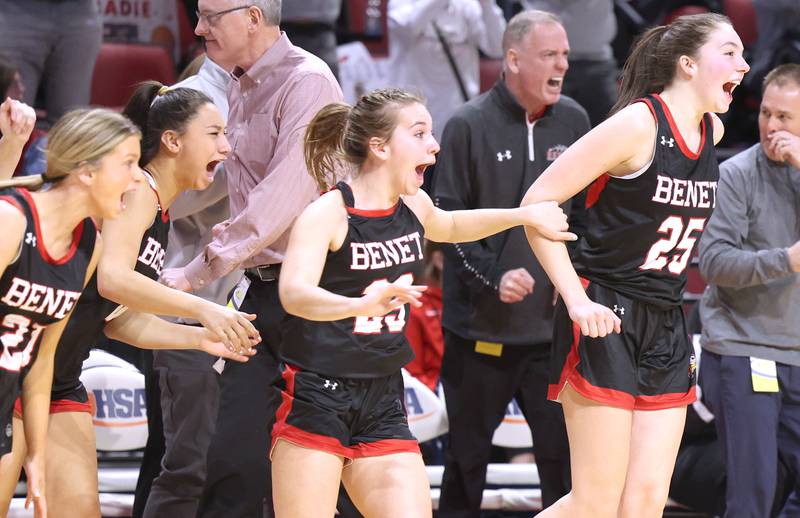 Benet players celebrate as the buzzer sounds in their win over Geneva in the Class 4A state semifinal game Friday, March 3, 2023, in CEFCU Arena at Illinois State University in Normal.