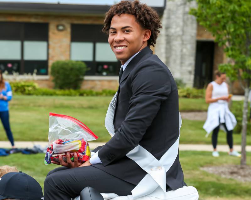 Julius Ellens of the homecoming court rides in the Glenbard West Homecoming Parade.  Sept 16, 2023