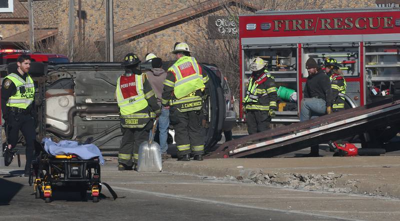Peru firefighters and paramedics work the scene of a multiple vehicle crash at the intersection of Illinois Route 251 and May Road on Monday, May, 27, 2025 in Peru. The crash happened around 12:45p.m. Ambulances from Peru, La Salle, Mendota Spring Valley, and Oglesby responded to the scene to transport multiple victims to area hospitals.