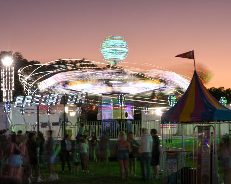 PrairieFest  attendees enjoy the popular Predator ride on Friday June 17, 2022 in Oswego.