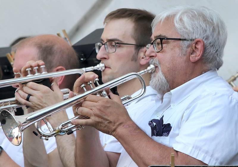 The trumpets play their part Tuesday, June 21, 2022, during the DeKalb Municipal Band concert at Hopkins Park in DeKalb. The band presents concerts at 7:30 p.m. during the summer every Tuesday through August 23, with the exception of July 5.