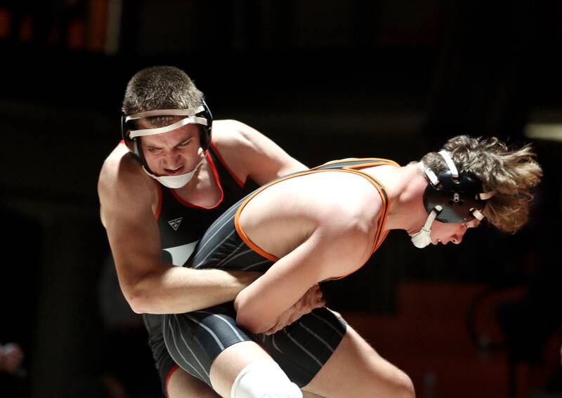 Crystal Lake Central’s Cayden Parks, right, battles Huntley’s Wyatt Theobald in a 190-pound bout in varsity wrestling at Crystal Lake Friday.  Parks won the match.