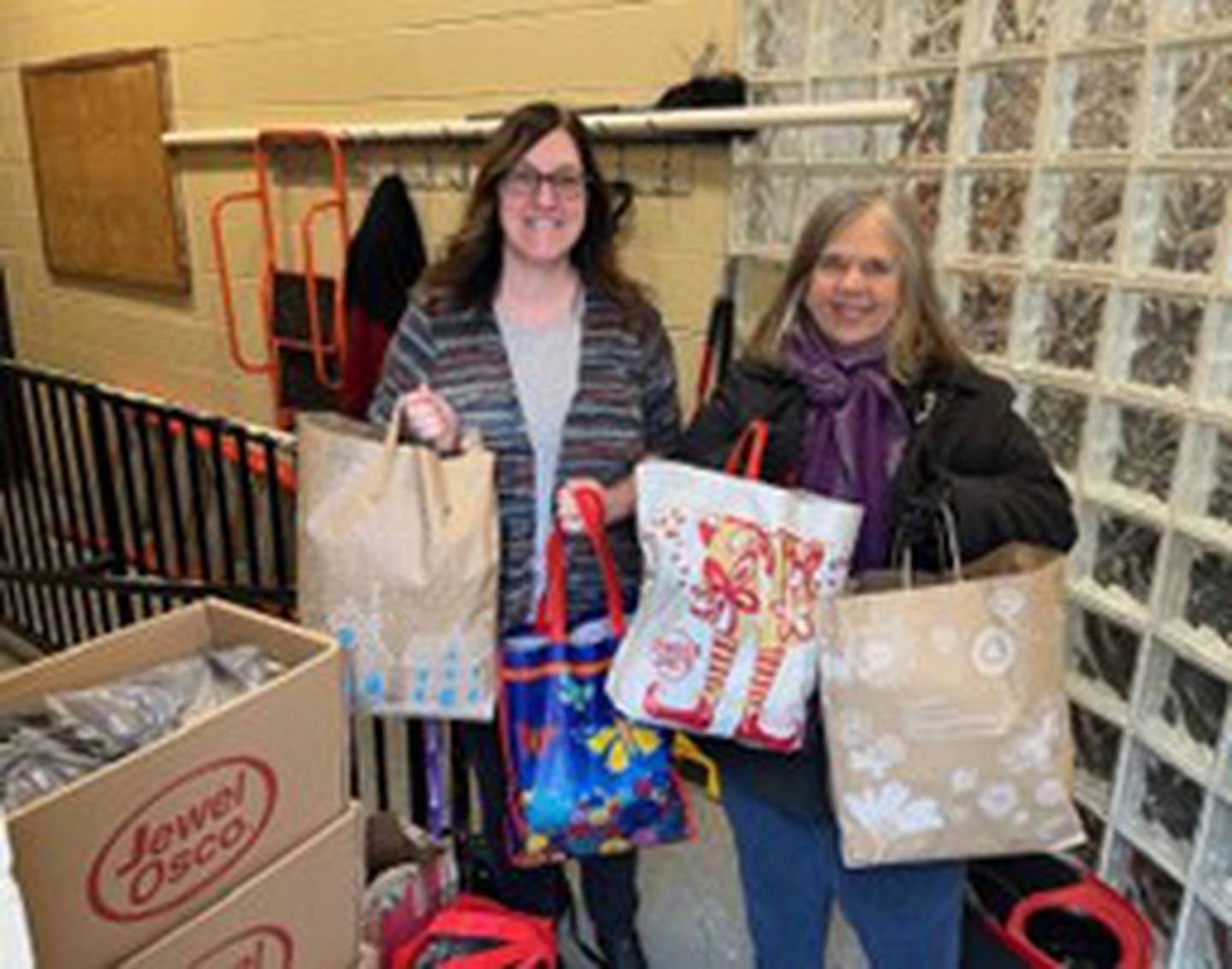 The Joliet Noon Lions recently held a winter collection drive for Daybreak Center, Catholic Charities, Diocese of Joliet. Pictured, from left are Stephanie Ambrose, manager of development at Catholic Charities, Diocese of Joliet and Bobbi Honiotes, member of the Joliet Noon Lions.
