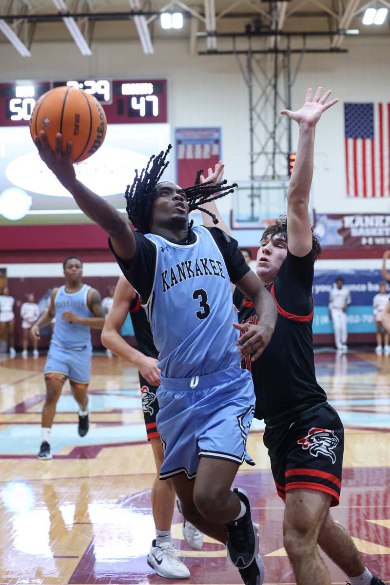 Kankakee's Cedric Terrell III goes for a layup during the Kays' 54-50 victory over Lincoln-Way Central in the 75th Kankakee Holiday Tournament maroon bracket championship on Sunday, Dec. 28, 2025.