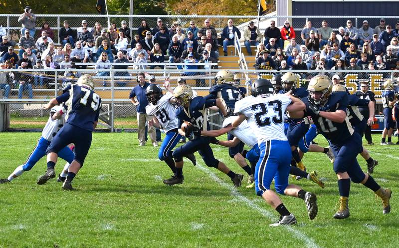 Polo's Avery Grenoble adds a chunk of yardage as he works his way down the middle of the field against West Prairie Saturday afternoon.