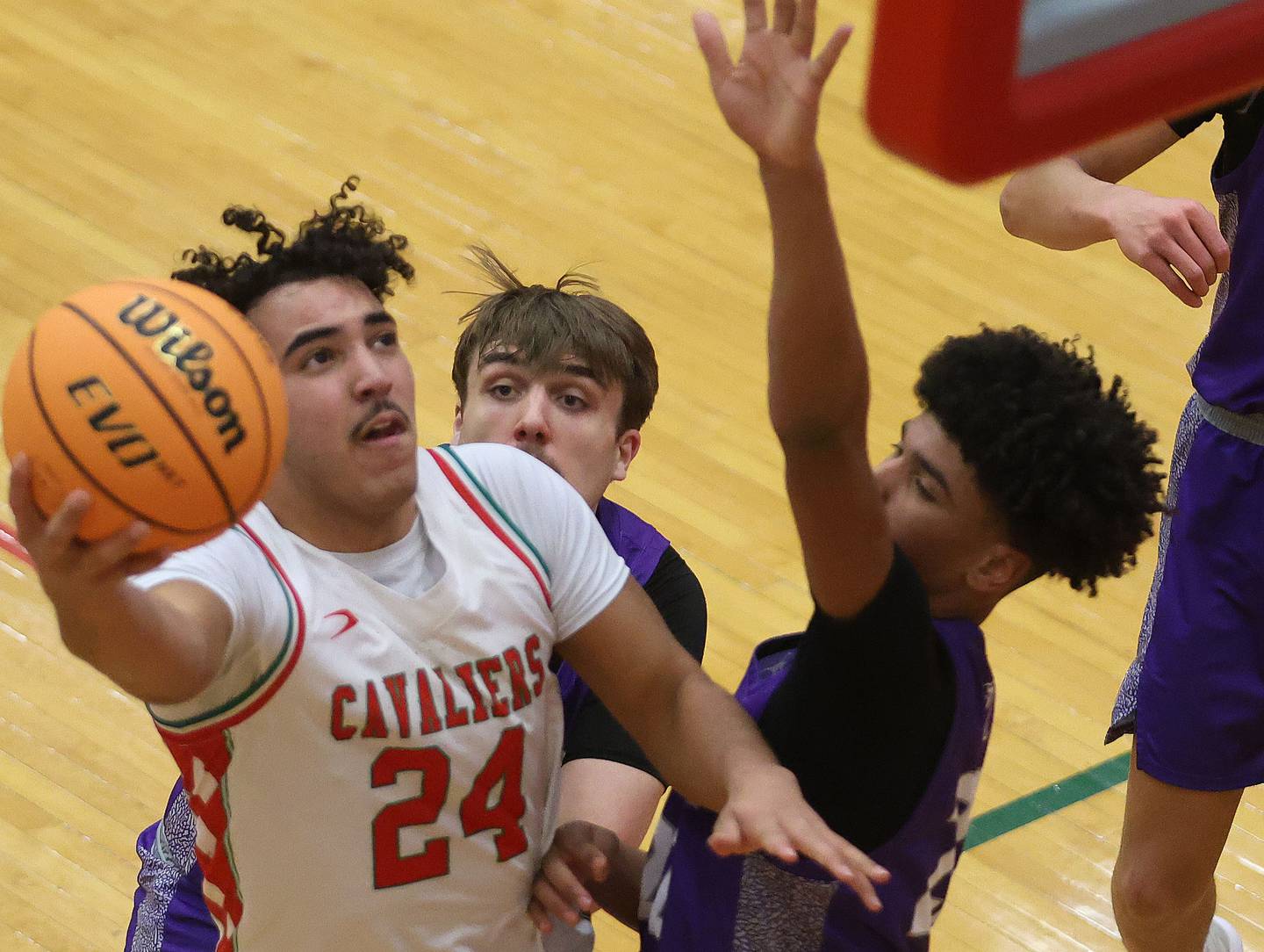 L-P's Marion Persich drives to the hoop to score over Dixon's Xavion Jones during the Class 3A Regional semifinal game on Wednesday, Feb. 25, 2026 in Sellett Gymnasium at L-P High School.