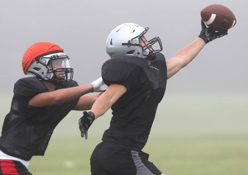 A  Kaneland receiver can’t quite haul a pass in during practice Wednesday, Aug. 9, 2023, at the school in Maple Park.