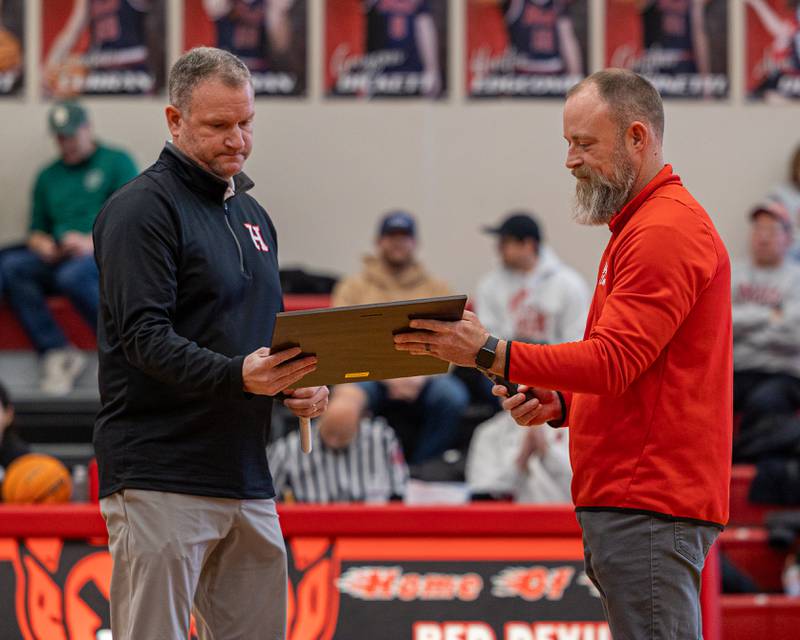 Adam Meyer principal of Hall High presents Head Coach Tom Keegan and the Hall Red Devils 2018 2A State Champions 2026 Hall High School Hall of Fame plaque on Saturday, January 31, 2026 at Hall High School in Spring Valley. Players inducted include Chance Resetich, Brayden DeBates, Cole Wozniak, Christian Stefaniak, Cam McDonald, Sean Riordan, Conner Ripka, Ty Rybarczyk, James Mautino, Matt Hultz, Payton Plym, Devin Soldati, Grant Resetich, Trez Rybarczyk, Jimmy DeAngelo, Gunner McCormick, Brant Vanaman, and Alec Bulak with coaches Tom Keegan, Matt McDonald, Kevin Sangston, Randy Tillman and Rhodes Gorlom.