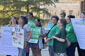 Photos: Northern Illinois University union workers march for higher pay, meet with president Lisa Freeman