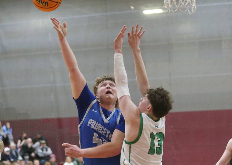 Princeton's Luke Smith lets go of the ball over Rock Falls's Ryken Howard during the Class 2A Sectional final on Friday, March 7, 2025 at Marengo High School.