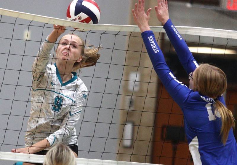 Woodstock North’s Clara Klasek hits the ball over the net against Woodstock in varsity volleyball at Woodstock North Monday night.