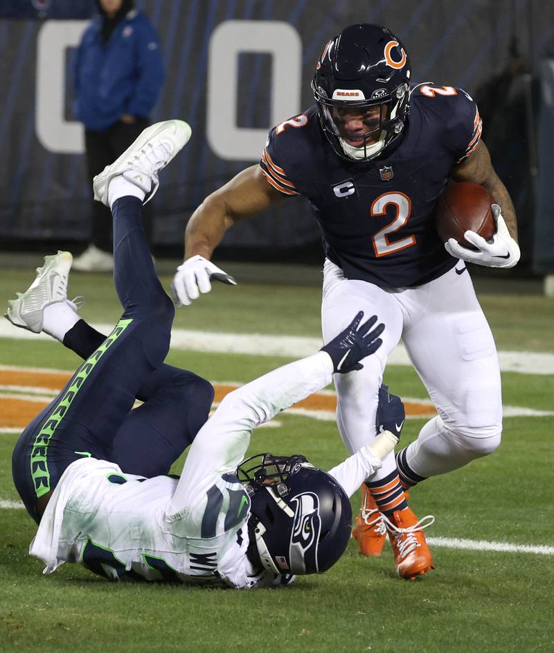 Chicago Bears wide receiver DJ Moore tries to get by Seattle Seahawks cornerback Devon Witherspoon during their game Sunday, Dec. 26, 2024, at Soldier Field in Chicago.