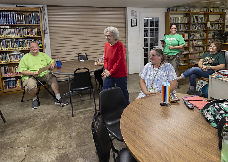 Teen Turf volunteer Donna Wellman steps to receive her certificate Tuesday, Sept. 26, 2023 in Amboy.