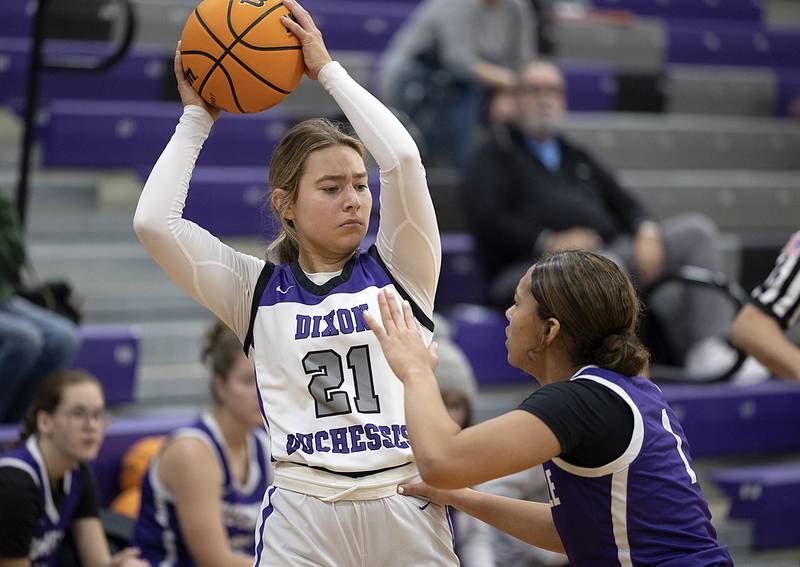 Dixon's Reese Dambman looks to pass while being guarded by Rochelle’s Carmela Bright Thursday, Dec. 26, 2024, during the Dixon Girl’s KSB Holiday Basketball Tournament.