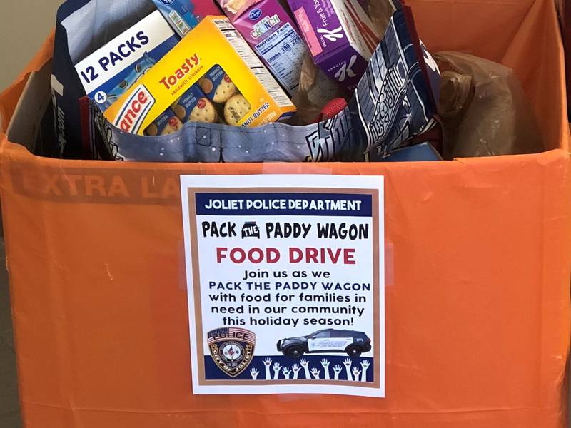 A collection of food sits at the Joliet Police Department in downtown Joliet for the annual Pack the Paddy Wagon Food Drive.