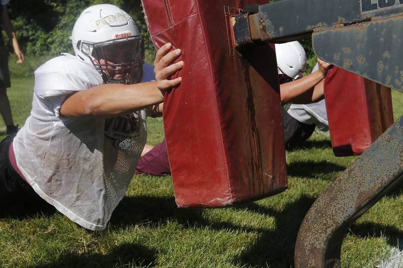 Prairie Ridge’s Walter Pollack takes part in a drill during football practice Monday, July 1, 2024, at Prairie Ridge High School .