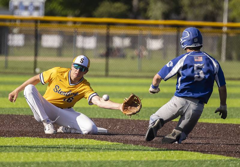 Sterling’s Garrett Polson catches and tags out Princeton’s  Ace Christiansen trying to steal second Tuesday, May 7, 2024 at Sterling’s Gartner Park.