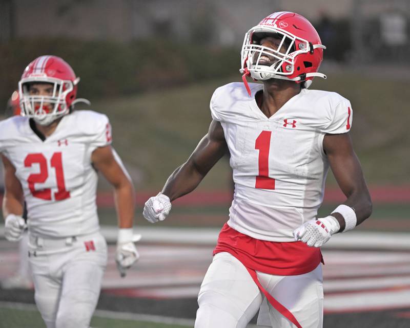 Naperville Central’s DeShaun Williams celebrates a touchdown catch in the first quarter of a cross-town rivalry football game against Naperville North at North Central College in Naperville on Friday, Sept. 6, 2024.