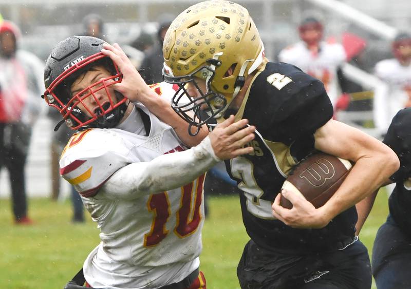 Polo's JT Stephenson (2) battles for yards against St. Anne's Grant Pomaranski (10) during I8FA playoff action on Saturday, Nov. 8, 2025 at Polo High School.