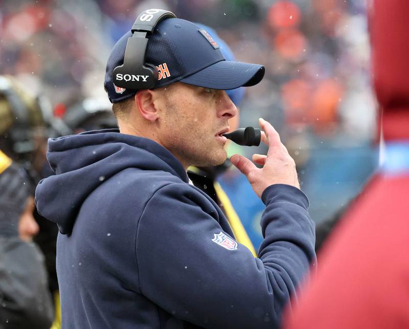 Chicago Bears Head Coach Ben Johnson talks into his headset Sunday, Nov. 9, 2025, during their game against the New York Giants at Soldier Field in Chicago.