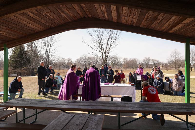 Area residents gather to participate in a Mass and prayer service held in Aroma Park on Thursday, March 12, 2026, following the EF-3 tornado that tore through the town and Kankakee County on March 10.
