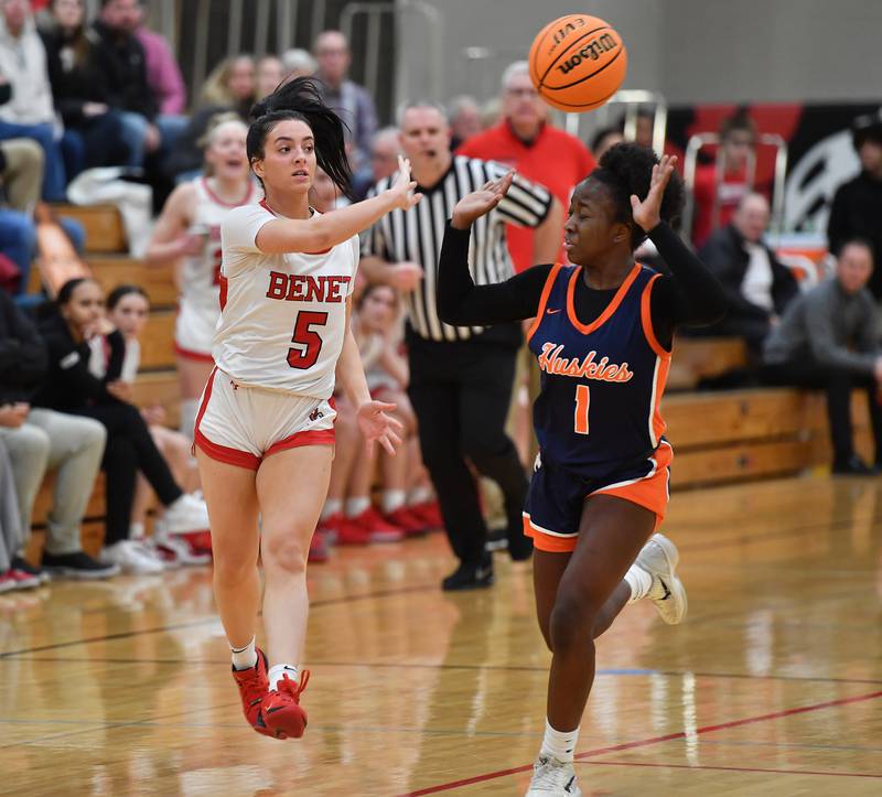 Benet’s Ava Thomas (5) whips a pass over Naperville North’s Natalie Frempong during the Class 4A Benet Regional championship game on February 20, 2025 at Benet Academy in Lisle.