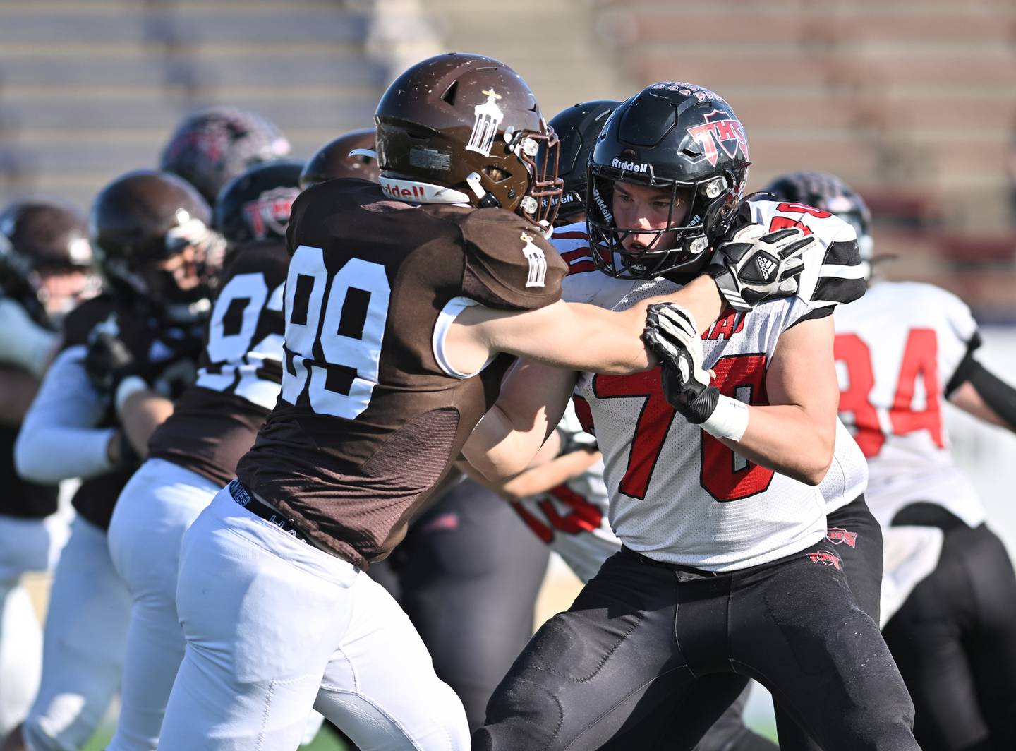 Triad's Hayden Holthaus (70) blocks Joliet Catholic Academy's defensive end Ian Campbell (99) during the class 5A second round playoff game on Saturday, Nov. 04, 2023, at Joliet. (Dean Reid for Shaw Local News Network)