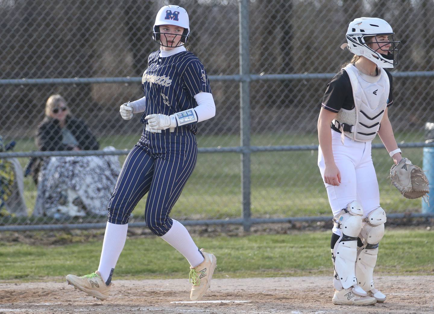 Marquette's Kelsey Cuchra crosses home plate in game last season at Serena High School.