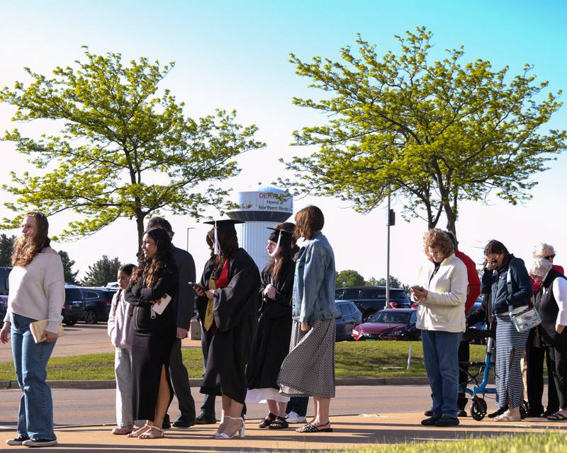 Northern Illinois University graduates and commencement goers wait in line to get into the convocation center on Saturday May 9, 2026, for the graduation ceremony in DeKalb.