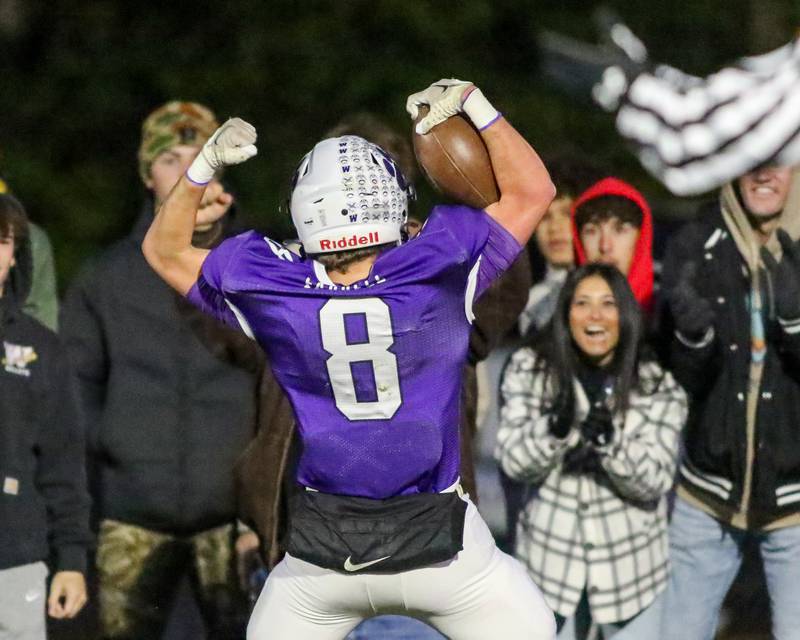 Wilmington's Kyle Farrell (8) celebrates a touchdown run with the crowd during Class 2A semi-final playoff football game between Moroa-Forsyth at Wimington.  Nov 18, 2023.