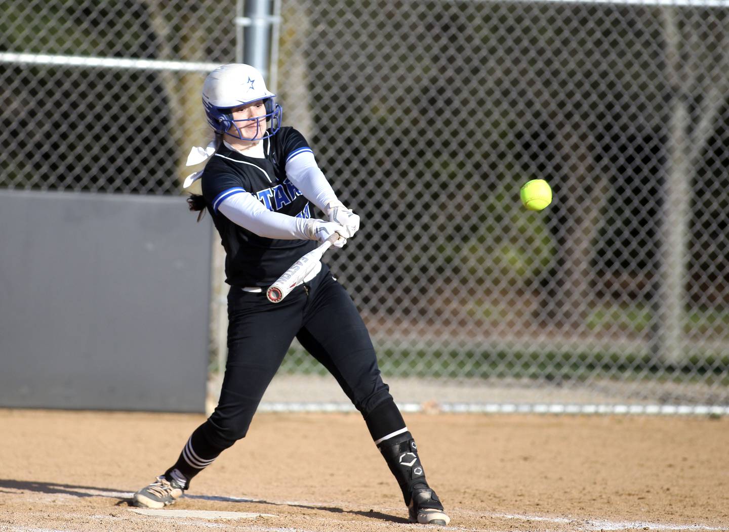St. Charles North’s Sophia Olman makes contact during a game at Wheaton Warrenville South on Thursday, April 14, 2022.