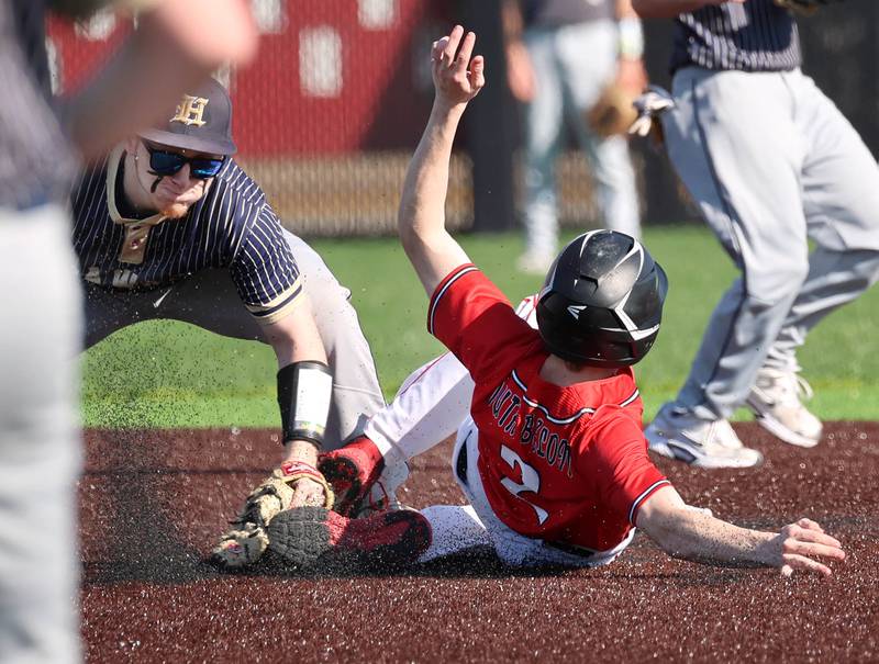 Hiawatha's Kamden Rasmus tags out South Beloit's JT Sanders as he tries to steal second Thursday, April 16, 2026, during their game at Northern Illinois University in DeKalb.