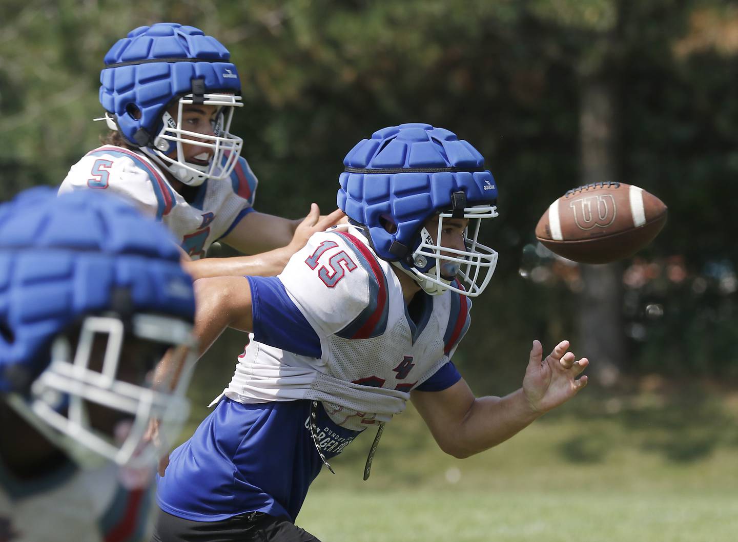 Dundee-Crown's Tristan Gatenby runs out of the backfield as the ball is snapped during football practice on Tuesday, July 29, 2025, at Dundee-Crown High School in Carpentersville.