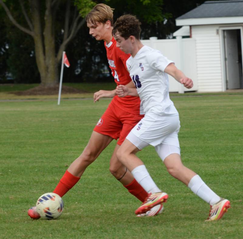 Oregon's Brian Wallace (14) battles Pecatonica's Evan Flores for the ball on Tuesday, Sept. 23, 2025 at Oregon Park West. Wallace had two assists in the Hawks' 2-1 win.