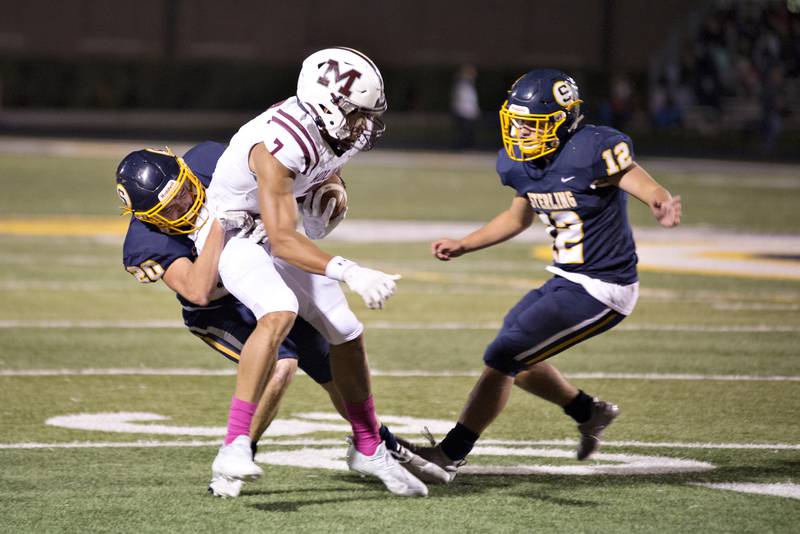 Sterling's Jacob Huffman brings down Moline's Matthew Bailey Friday, Oct. 15, 2021.