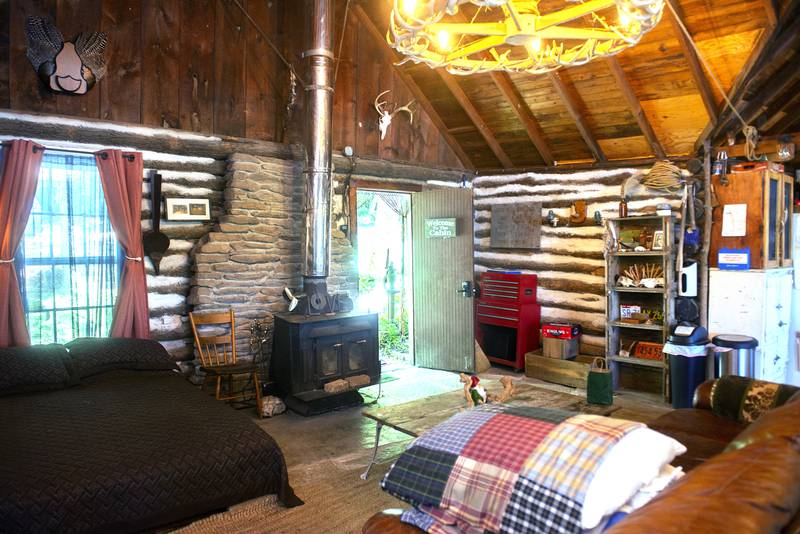 The living area of Tim Benedict's cabin is rustic and warm.