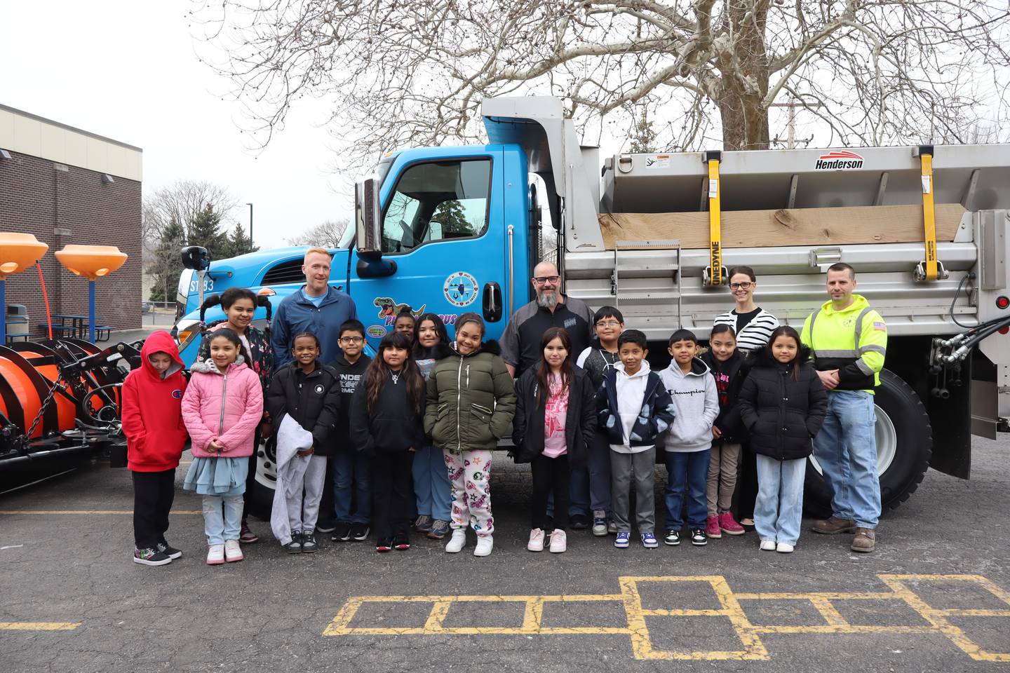 Woodland Elementary School students in Joliet stand alongside the newly named Plowasaurus Rex city snow plow. The city of Joliet in January invited students with Joliet Public Schools District 86  to submit names for city snow plows.