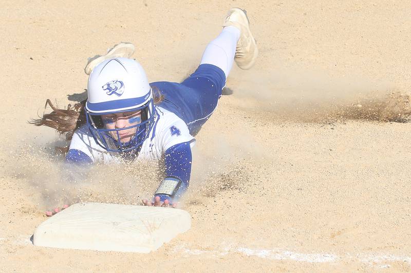 Princeton's Caroline Keutzer slides into third base on Tuesday, March 19, 2024 in Princeton.