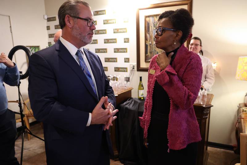 Diane Harris, candidate for State Senate, and Bob Bodach, candidate for Will County Circuit Court Judge, talk at the GOP event at Its Amazing in Joliet on Monday.