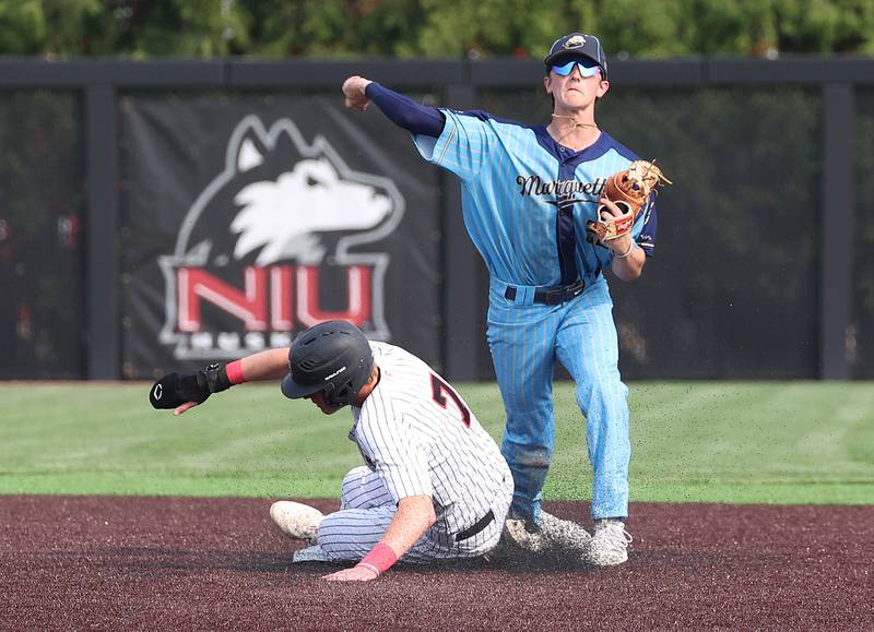 Marquette's Griffin Dobberstein tries to turn a double play as Fulton's Jacob Huisenga tries to break it up Monday, June 2, 2025, during their Class 1A supersectional game at Northern Illinois University in DeKalb.