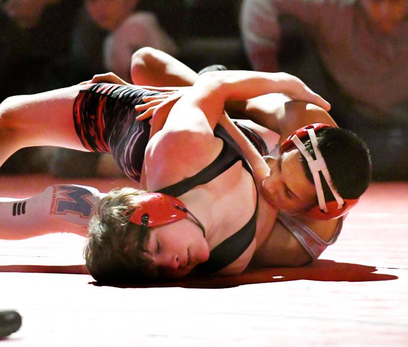 Woodstock Marian's Andrew Alvarado (right) wrestles Amboy's Landon Blanton of Amboy for the championship at 113 pounds at the 1A Oregon Wrestling Sectional on Saturday. Alvardo won the match.