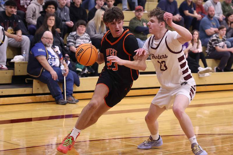 Lincoln-Way West’s Wyatt Carlson drives to the baseline against Lockport on Friday, Dec. 6, 2024 in Lockport.