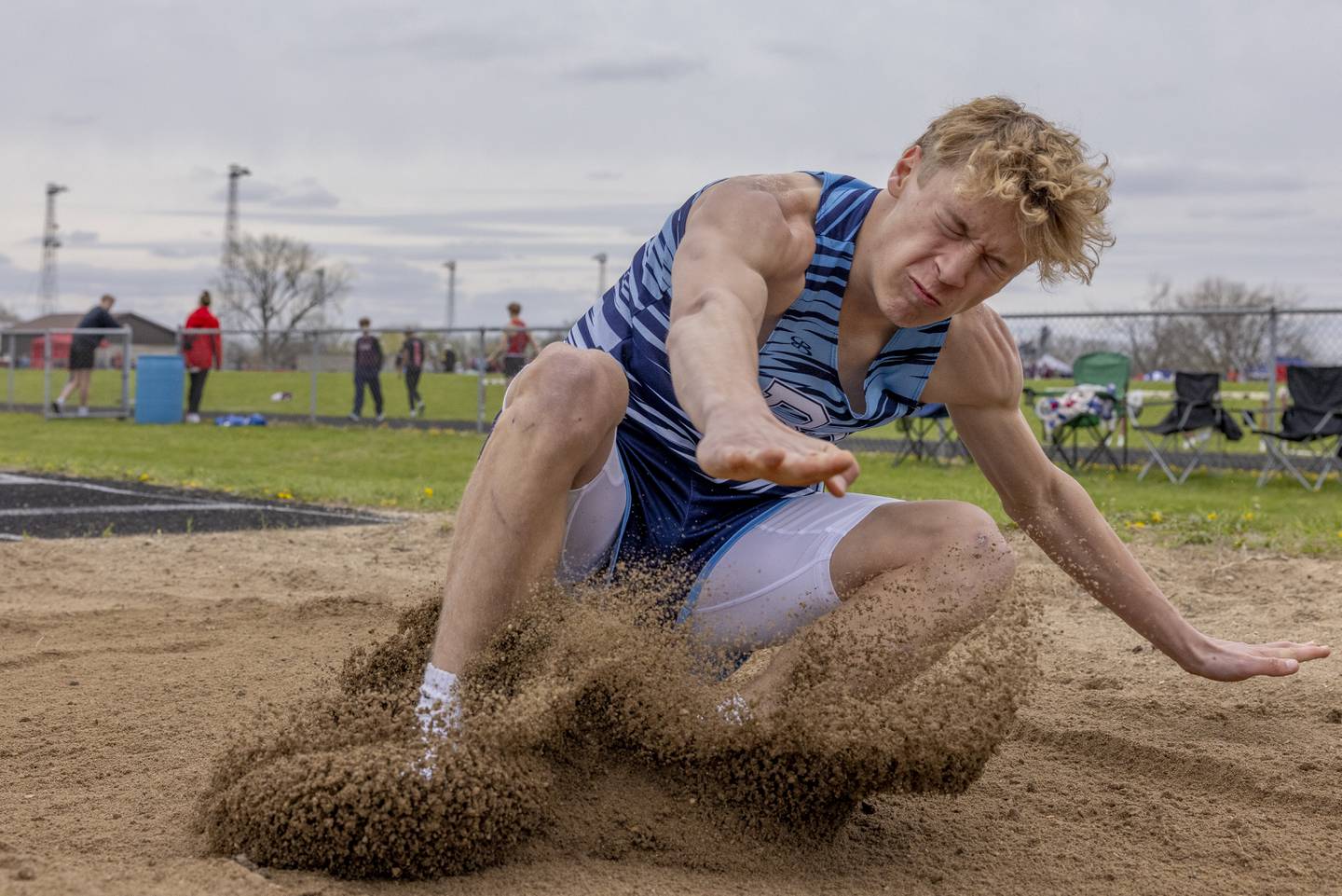 Bureau Valley's Keenyn Richter impacts the sand during the boys long jump event during the Rollie Morris Invite on April 19, 2025 at Hall High School.