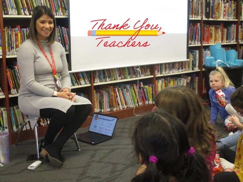 Yorkville Grade School social worker Adriana Resendiz greets students before the start of a yoga and mindfulness lesson.