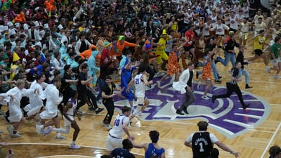Princeton native John Washo works the famous ‘Silent Night’ game at Taylor University  