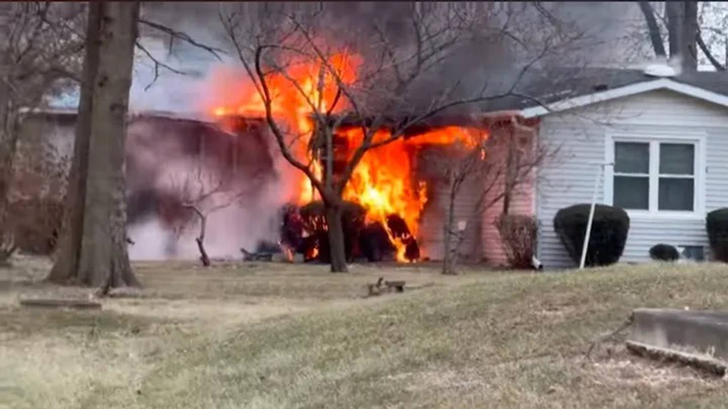 A still frame from a video shows Ann Loitz's home at 1220 S. Dixie Highway, Beecher, engulfed in flames on Dec. 12, 2024.