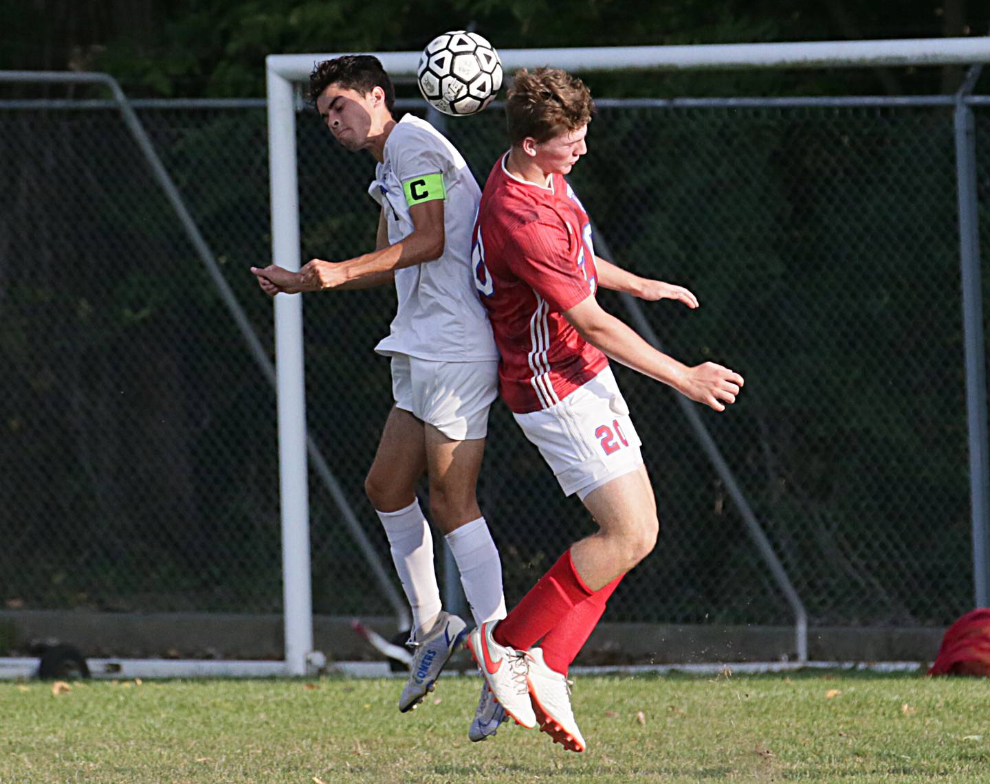 Streator's Brady Grabowski (20) and Peotone's Dylan Lattz (15) leap in the air for a header during an Illinois Central Eight Conference match this past fall as the SHS Athletic Fields.